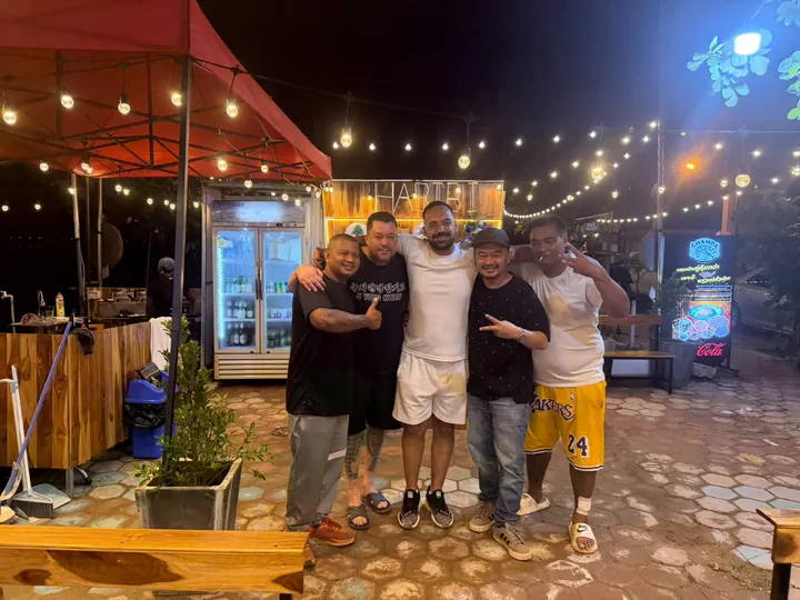 Guests posing together on the Habibi Eatery terrace